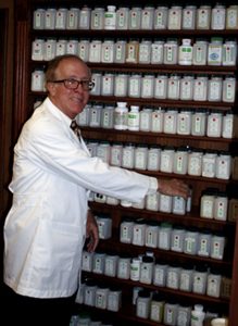 Paul Finney standing in front of the Herbology Pharmacy inside the Finney Acupuncture Clinic which is located at 2108 West 75th Street Suite A Prairie Village, KS. 66208